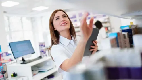 Two beautiful pharmacists working together in a drug store and doing a stock take. Portrait of a positive healthcare workers or a chemists at their work.